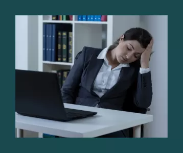 Woman asleep at desk